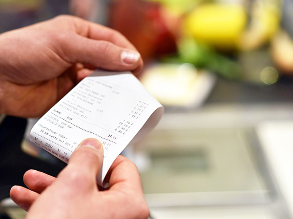 Someone looking at a receipt 