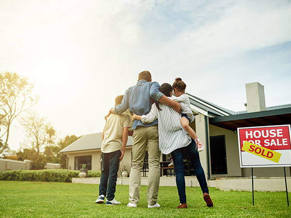 A young family looking at their newly purchased house