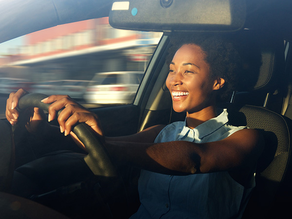 women driving  fast car 